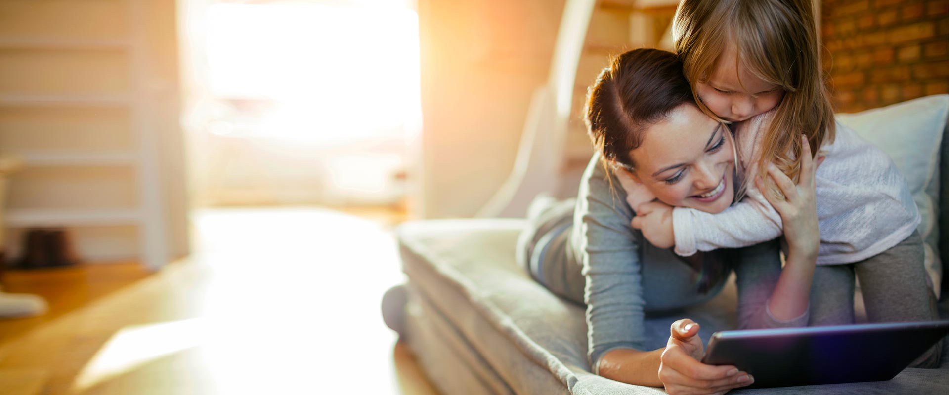 A parent and young child sharing a quiet moment at home